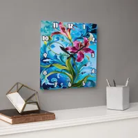 Vibrant Lily Blooms Against Blue Swirls Square Wall Clock