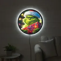 The Grinch holding a colorful present at Christmas LED Sign