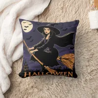 A witch flying over a haunted landscape at night throw pillow