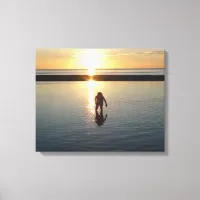 Little Girl Playing at Sunset in Low  Tide Water Canvas Print