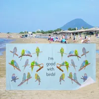 Lots of colorful parakeets - fun little birds   beach towel