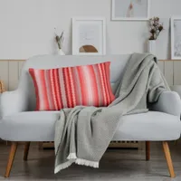 Modern striped design in various shades of red accent pillow