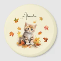 Cute Orange Tabby Kitten in Fall Leaves