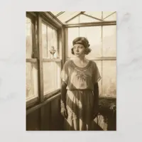 Vintage woman in a greenhouse sepia photo  postcard