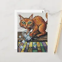 A ginger cat knocks over a glass of ice postcard