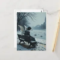 Sad angel sitting on a park bench postcard