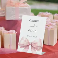 Pink bow white cards gifts sign