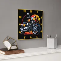 Fiery motorcycle against a tropical sunset skyline square wall clock