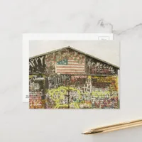  A rural barn covered in graffiti  Postcard