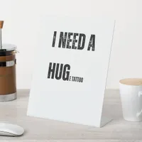 I Need a Hug Huge Tattoo Playful Word Twist Pedestal Sign