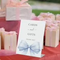 Blue bow white cards gifts sign