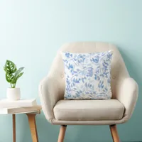 Blue and white tropical leaf coastal throw pillow