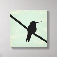 Hummingbird Silhouette on Blue Grunge Background Canvas Print