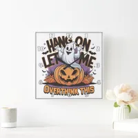 Cheerful Halloween ghost atop a carved pumpkin Square Wall Clock