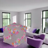 Mixed flowers in modern art on gray pouf