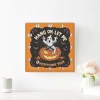 A playful ghost pondering above a jack-o'-lantern square wall clock