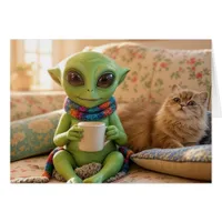 An adorable alien and pet cat coffee on the couch