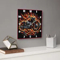 Fiery motorcycle roaring through vibrant flames square wall clock