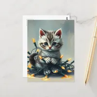 A cute Kitten Wrapped in Christmas Lights Postcard