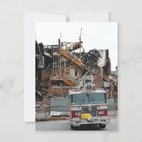 A collapsed and burnt building and a fire truck postcard