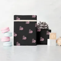 A bold black and pink filigree heart design wrapping paper