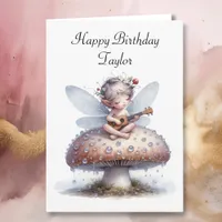 Cute Fairy with Viola on Mushroom Birthday Card