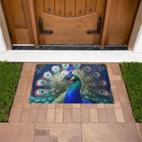 Gorgeous peacock with teal and gold plumage doormat