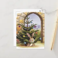 The Cute Little Christmas Bunny Nibbles the Tree Postcard