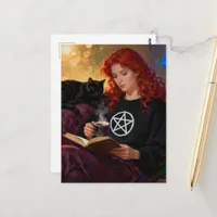 A witch and her cat enjoying tea and a book postcard