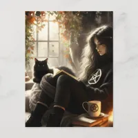 A witch reads with her black cat postcard