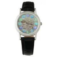 Seashells and Sea Glass on Beach Sand Watch