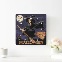 A witch flying over a haunted landscape at night square wall clock