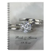 Wedding Rings on Gray Notebook