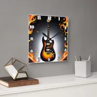 A fiery guitar shining in the spotlight square wall clock