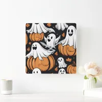 Whimsical ghosts playing among Halloween pumpkins Square Wall Clock