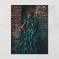 Model in a Green Feather Dress Poses against Brick Postcard