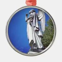 Angel and a bright blue sky metal ornament