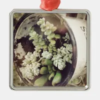 A cup full of succulent plants metal ornament