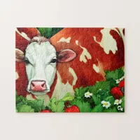 Red and White Dairy Cow in a Strawberry Patch  Jigsaw Puzzle