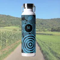 Modern, trendy blue circles on black monogram  water bottle