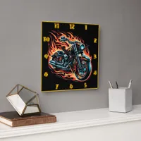 Fiery motorcycle roaring through a night of flames square wall clock