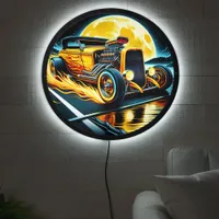 Custom hotrod racing under a glowing full moon LED sign