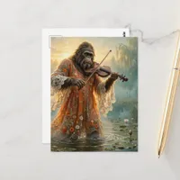 Sasquatch with a violin in the lily pond postcard