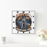 A witch contemplating under a full moon at dusk square wall clock