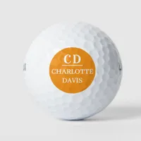 Orange monogrammed name golf balls