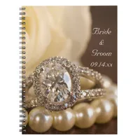 Oval Diamond Ring and White Rose Wedding Notebook