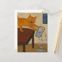 A cute ginger cat knocks over a glass of ice postcard