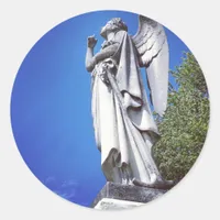 Angel and a bright blue sky classic round sticker
