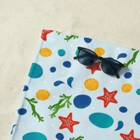 Summer beach with starfish, shells and pebbles beach towel