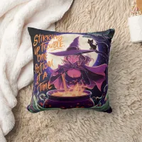 A witch brewing potions under a full moon throw pillow